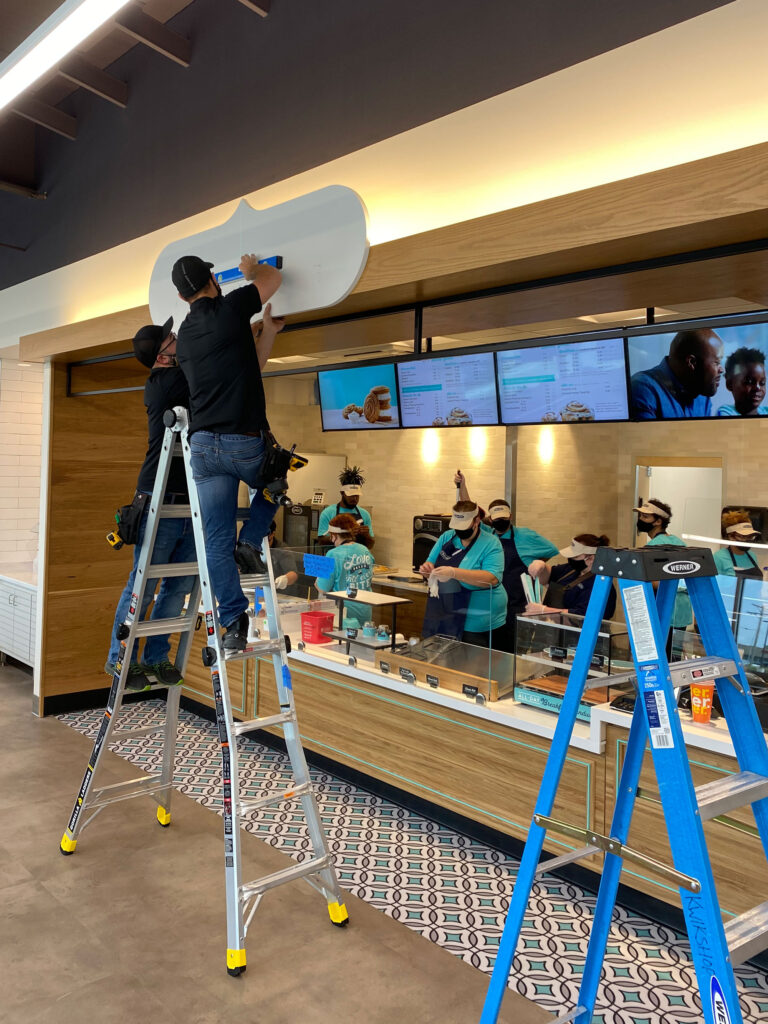 Cinnabon branded signage installation