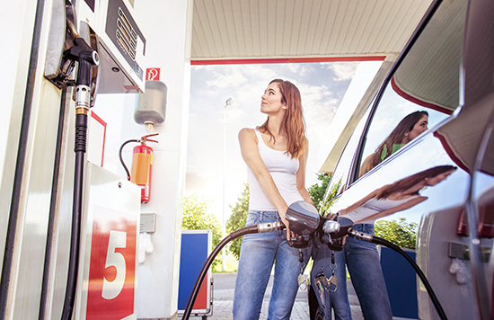 woman pumping gas